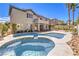 Resort-style backyard with a sparkling pool, spa, and well-maintained landscaping at 3552 Coventry Gardens Dr, Las Vegas, NV 89135