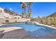 Inviting backyard pool and spa area with mature palm trees and outdoor living space at 3552 Coventry Gardens Dr, Las Vegas, NV 89135