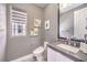 Modern bathroom featuring a sleek vanity, minimalist fixtures, and ample natural light at 3552 Coventry Gardens Dr, Las Vegas, NV 89135