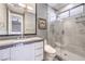Modern bathroom featuring a glass-enclosed shower, sleek vanity, and minimalist fixtures at 3552 Coventry Gardens Dr, Las Vegas, NV 89135