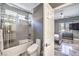 A bright bathroom featuring a shower and bathtub, complemented by stylish fixtures and decor at 3552 Coventry Gardens Dr, Las Vegas, NV 89135