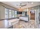 Elegant bathroom features soaking tub, double sink vanity, and tile accent wall at 3552 Coventry Gardens Dr, Las Vegas, NV 89135