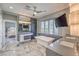 Bright bathroom features soaking tub, walk-in closet, and access to bedroom at 3552 Coventry Gardens Dr, Las Vegas, NV 89135