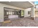 Covered patio with brick flooring offering an outdoor living space with views into the home at 3552 Coventry Gardens Dr, Las Vegas, NV 89135