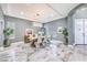 Bright dining room featuring modern decor, a stylish chandelier, and large windows at 3552 Coventry Gardens Dr, Las Vegas, NV 89135