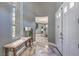 Elegant foyer featuring high ceilings, marble floors, and a view into the adjacent dining area at 3552 Coventry Gardens Dr, Las Vegas, NV 89135