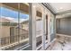 Hallway features French doors to balcony, and white marble floors at 3552 Coventry Gardens Dr, Las Vegas, NV 89135