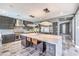 Modern kitchen featuring a large center island, stainless steel appliances, and stylish gray cabinetry at 3552 Coventry Gardens Dr, Las Vegas, NV 89135