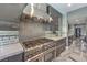 Modern kitchen with stainless steel appliances, a sleek range hood, and mosaic backsplash at 3552 Coventry Gardens Dr, Las Vegas, NV 89135