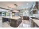 Open kitchen with a large central island, stainless steel appliances, and abundant natural light with a clear view to living room at 3552 Coventry Gardens Dr, Las Vegas, NV 89135