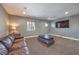 Relax in this cozy living room with plush seating, neutral walls, and recessed lighting at 3552 Coventry Gardens Dr, Las Vegas, NV 89135