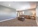 Spacious living room featuring neutral paint, large windows, and comfortable seating at 3552 Coventry Gardens Dr, Las Vegas, NV 89135