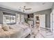 Bright bedroom features seating, private bath, and balcony views at 3552 Coventry Gardens Dr, Las Vegas, NV 89135