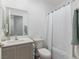 Bathroom features a shower with tub, modern sink with vanity and a large mirror at 3585 Arcadian Sea St, Las Vegas, NV 89106