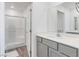 Well-lit bathroom featuring a tiled shower and a vanity at 3585 Arcadian Sea St, Las Vegas, NV 89106