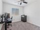 Bedroom with a ceiling fan, neutral walls, and a large window at 3585 Arcadian Sea St, Las Vegas, NV 89106