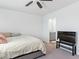 Bright bedroom with light carpet, a modern TV and an ensuite bathroom at 3585 Arcadian Sea St, Las Vegas, NV 89106