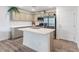 Modern kitchen featuring stainless steel appliances, grey cabinets, and a large center island at 3585 Arcadian Sea St, Las Vegas, NV 89106