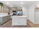 Modern kitchen featuring stainless steel appliances, a kitchen island, and shaker cabinets at 3585 Arcadian Sea St, Las Vegas, NV 89106