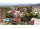 An aerial shot showcases the complex, pool, and landscaping with views of the surrounding community and distant mountains at 3740 Desert Marina Dr # 2, Laughlin, NV 89029