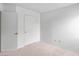 Bedroom features neutral carpet, white walls, and closet for storage at 3740 Desert Marina Dr # 2, Laughlin, NV 89029