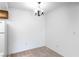 Minimalist dining area with overhead lighting and clean, white walls at 3740 Desert Marina Dr # 2, Laughlin, NV 89029