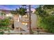 Charming condo showcases stucco facade, stairway access, and verdant trees at 3740 Desert Marina Dr # 2, Laughlin, NV 89029