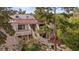 Cozy two-story condo featuring private balconies, a red tile roof, and desert landscaping at 3740 Desert Marina Dr # 2, Laughlin, NV 89029