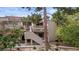 Charming condo building with inviting stairs, well-manicured landscaping, and mature trees at 3740 Desert Marina Dr # 2, Laughlin, NV 89029