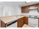 Well-equipped kitchen features a dishwasher, stove, ample counter space, and wooden cabinets at 3740 Desert Marina Dr # 2, Laughlin, NV 89029