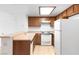 Updated kitchen with wood cabinets, white appliances, and practical layout at 3740 Desert Marina Dr # 2, Laughlin, NV 89029