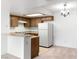 Functional kitchen features wood cabinets, updated appliances, and a convenient breakfast bar at 3740 Desert Marina Dr # 2, Laughlin, NV 89029