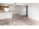Open living area showcases neutral carpet and adjacent kitchen space at 3740 Desert Marina Dr # 2, Laughlin, NV 89029