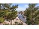 This view offers a glimpse of the neighborhood street lined with trees and parked cars at 3740 Desert Marina Dr # 2, Laughlin, NV 89029
