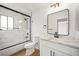 Contemporary bathroom showcasing a shower-tub combo and a marble countertop vanity at 389 Umbria Way, Henderson, NV 89014
