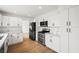 Bright, modern kitchen with stainless steel appliances, stone countertops, and ample cabinet space at 389 Umbria Way, Henderson, NV 89014