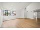 Spacious living room featuring ample natural light and elegant wood-look flooring at 389 Umbria Way, Henderson, NV 89014