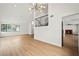 Open living area with wood-look floors, abundant light, and views to the staircase and fireplace at 389 Umbria Way, Henderson, NV 89014