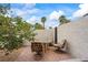 Outdoor patio area featuring a round table and four chairs set on a brick surface at 389 Umbria Way, Henderson, NV 89014