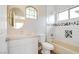 Modern bathroom featuring decorative backsplash and updated fixtures and finishes at 4 Chatmoss Rd, Henderson, NV 89052