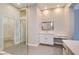 Bright bathroom featuring a modern vanity, large mirror and walk-in glass shower at 4 Chatmoss Rd, Henderson, NV 89052