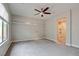 The bedroom has a ceiling fan, a large window that lets in lots of natural light and carpet floors at 4 Chatmoss Rd, Henderson, NV 89052