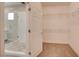 Walk-in closet featuring built-in shelving adjacent to the glass shower in ensuite bathroom at 4 Chatmoss Rd, Henderson, NV 89052