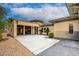 Exterior with stone accents, neutral paint, desert landscaping and covered porch at 4 Chatmoss Rd, Henderson, NV 89052