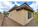 Exterior shows neutral stucco, corner view, side yard and desert landscaping at 4 Chatmoss Rd, Henderson, NV 89052
