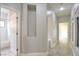 Hallway with bright light, tile floor, and doors to other rooms in home at 4 Chatmoss Rd, Henderson, NV 89052