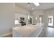 A view of the bright kitchen with large center island, modern appliances, and lots of cabinet space at 4 Chatmoss Rd, Henderson, NV 89052