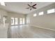Spacious living room boasts wood floors, recessed lighting, ceiling fan and windows overlooking the outdoor space at 4 Chatmoss Rd, Henderson, NV 89052