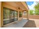 Covered patio with ceiling fan, concrete pavers, and access to the backyard at 4 Chatmoss Rd, Henderson, NV 89052