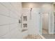 Close up of a modern shower with glass door, pebble floor, and dual shower heads at 4 Chatmoss Rd, Henderson, NV 89052
